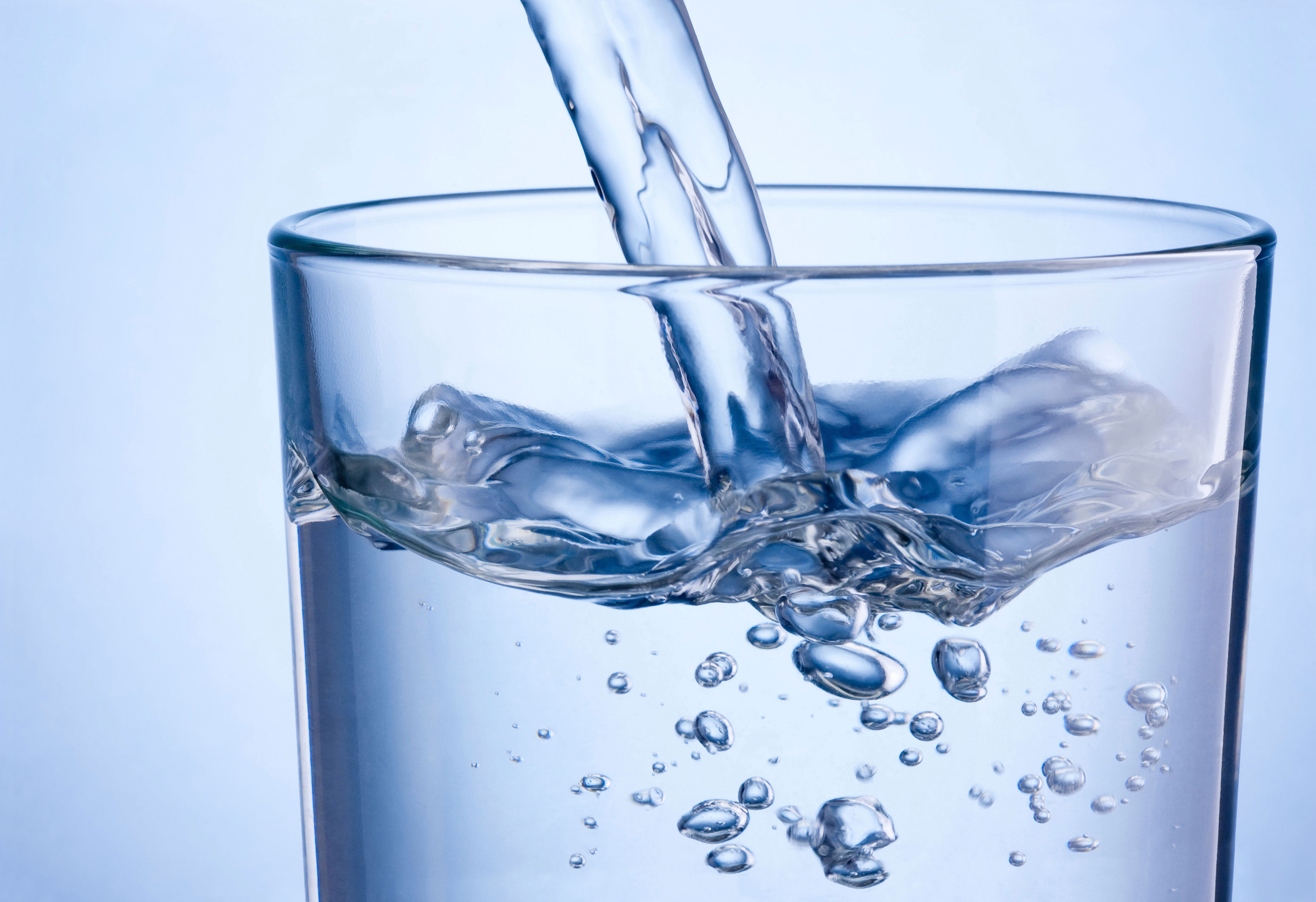 Pouring water into glass